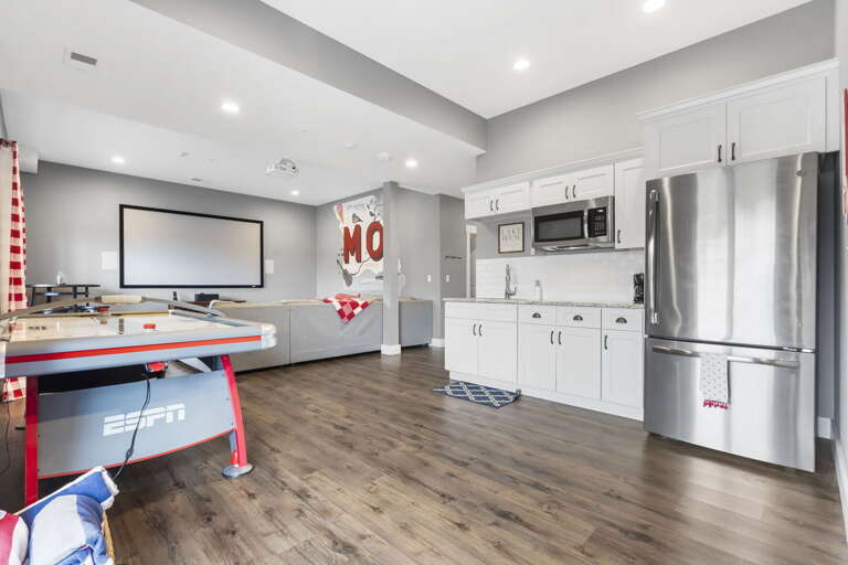 Interior Of A Room With Kitchen And Air Hockey Table