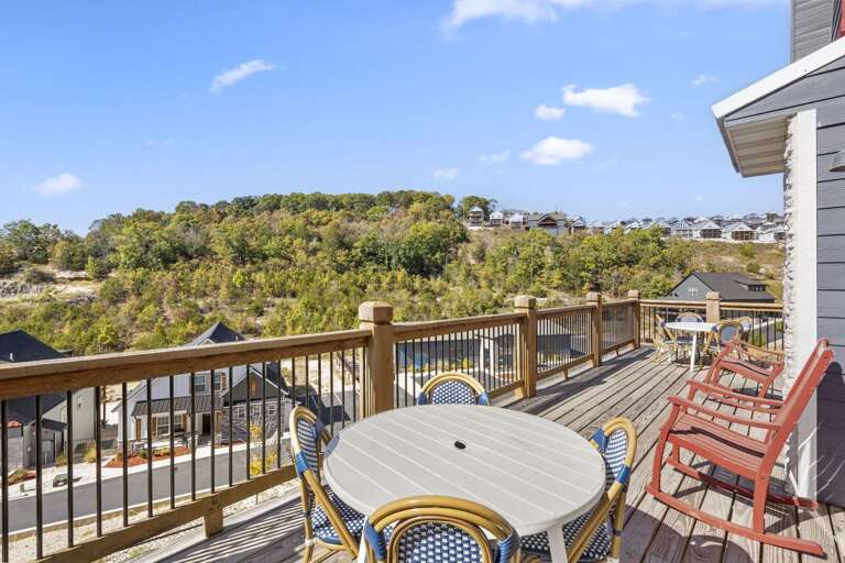 Vacation Rental Balcony With Bountiful View, Table, And Chairs