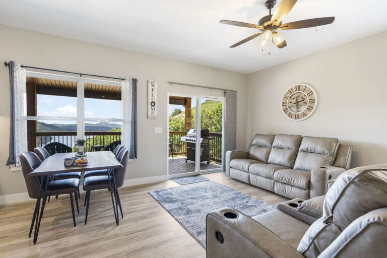 Living Room With Furniture And Balcony Access