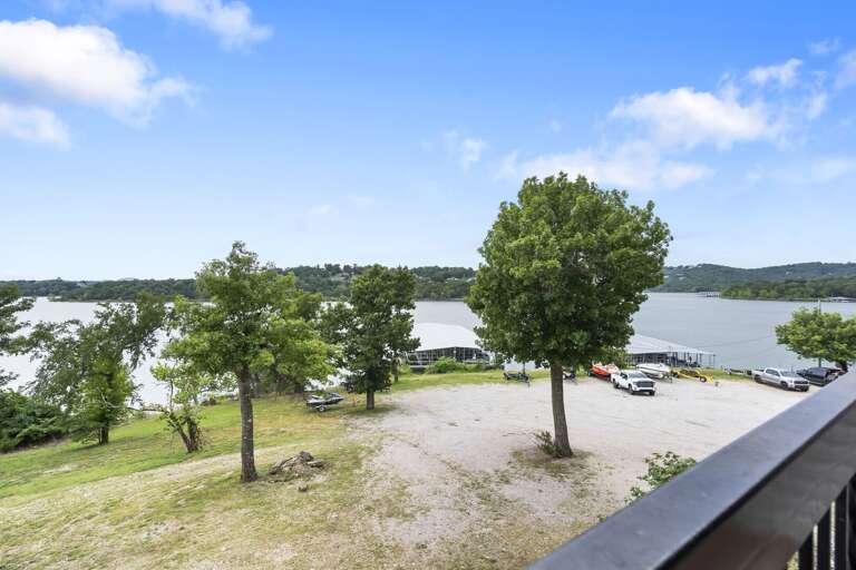 Lake View From Balcony With Trees And Parking Lot Lake View From Balcony With Trees And Parking Lot