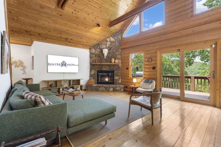 Interior Living Space With Fireplace And Balcony Access