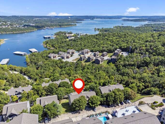 Aerial View Of Lakeside Vacation Rental Nestled Among Trees