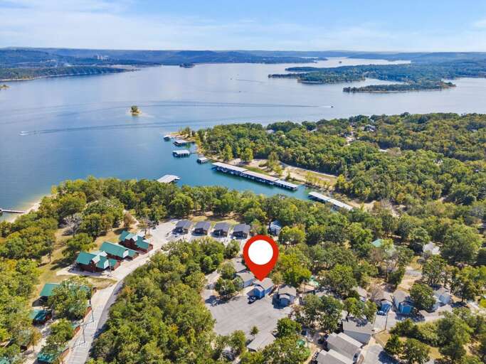 Aerial View Featuring Lakeside Vacation Rental Amidst Lush Greenery