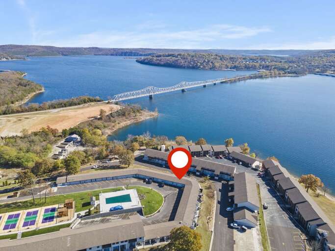 Serene Scenery Of A Lakeside Locale With Striking Bridge Views