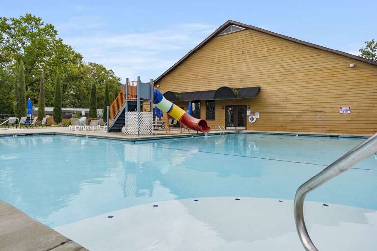 Poolside Pleasure, Playful Slide, Serene Setting