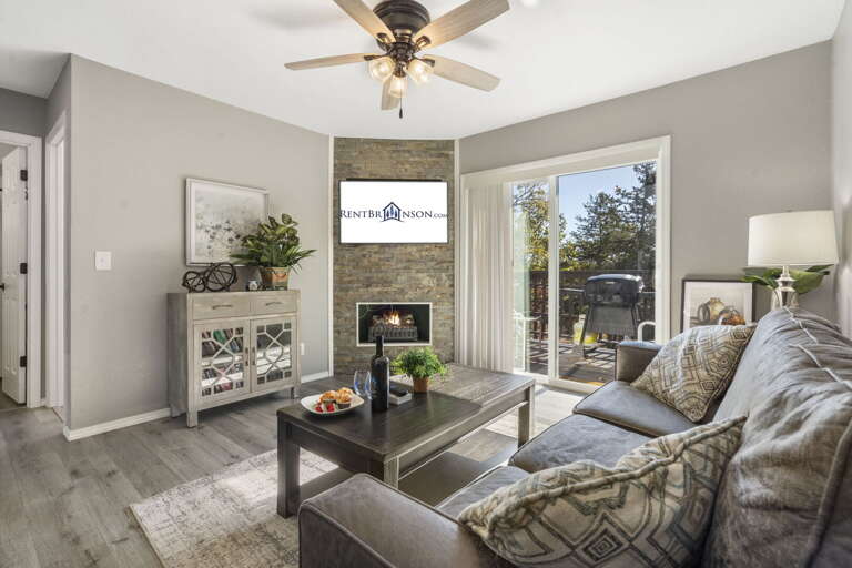 Bright Living Room Leads To A Sunny Patio In A Vacation Rental