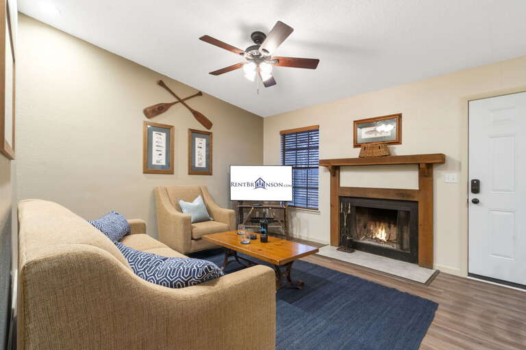 Interior Living Space With Sofa, Fireplace, Mounted Television