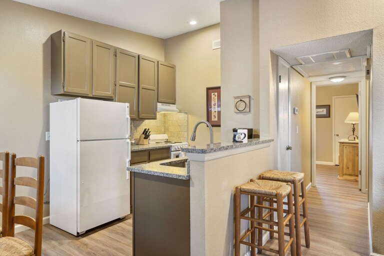 Kitchen Space Sporting Simple Setup, Soft Shades, And Sleek Surfaces