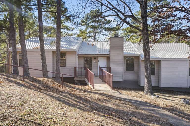 Serene Suburban Structure Surrounded By Slender Saplings, Showcasing A Simple Vacation Rental Serene Suburban Structure Surrounded By Slender Saplings, Showcasing A Simple Vacation Rental