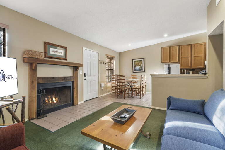 Interior With Fireplace, Furnished Living Space Leading To Kitchen, Muted Hues