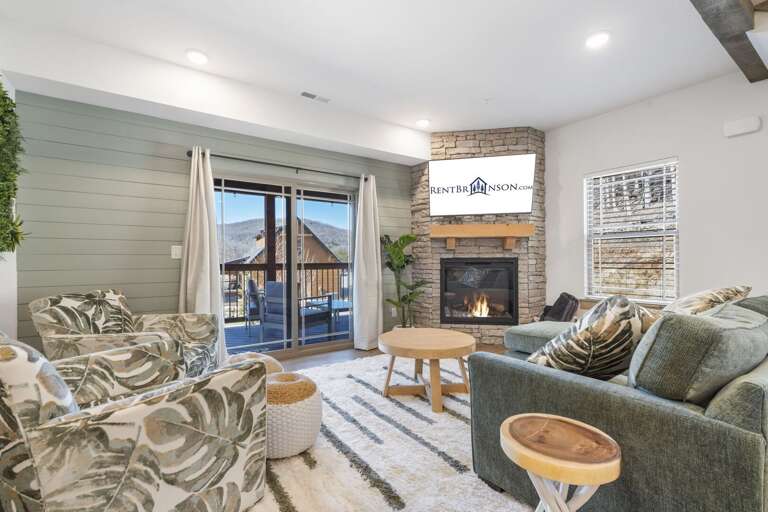 Living Room Leading To Balcony In Vacation Rental, Fireplace, Plush Seating, Sliding Doors
