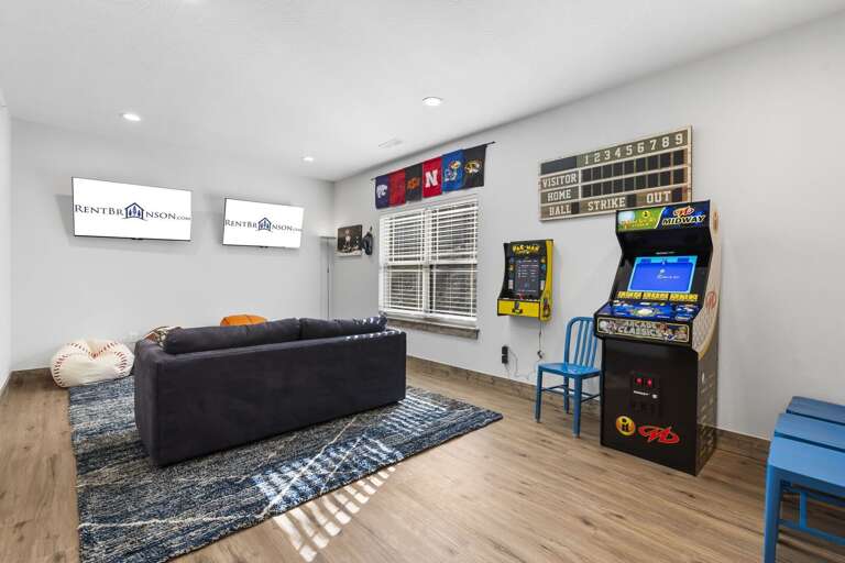 Bright Basement Vacation Rental With Arcade Games And Wooden Floors
