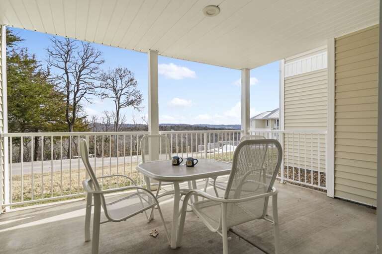 Balcony View Of Breezy Blue Lake, Chairs And Table Set, Serene Setting