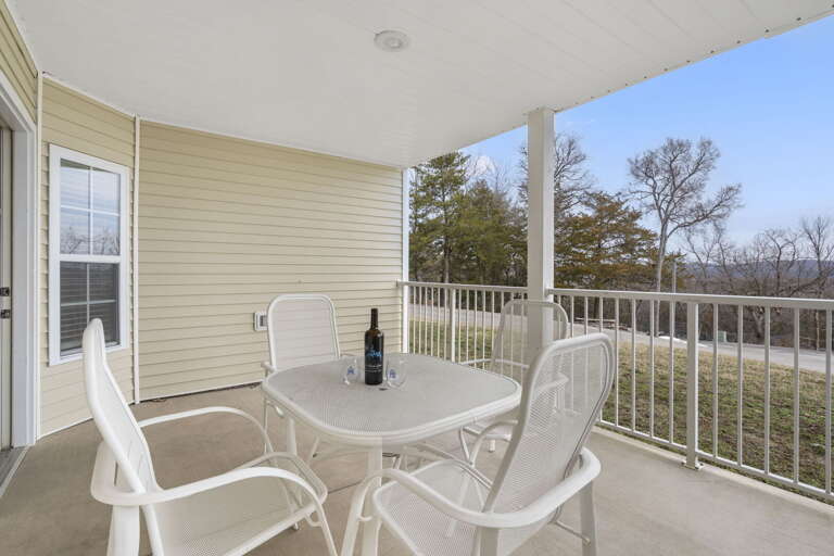 Vacation Rental Balcony With Table And Chairs, Serene Scenery
