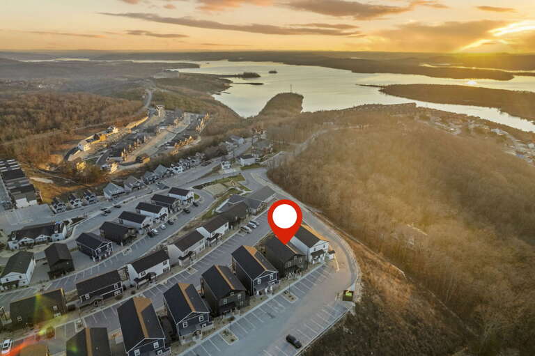 Aerial View Of Lakeside Vacation Rental, Marked With Red Pin At Sunset