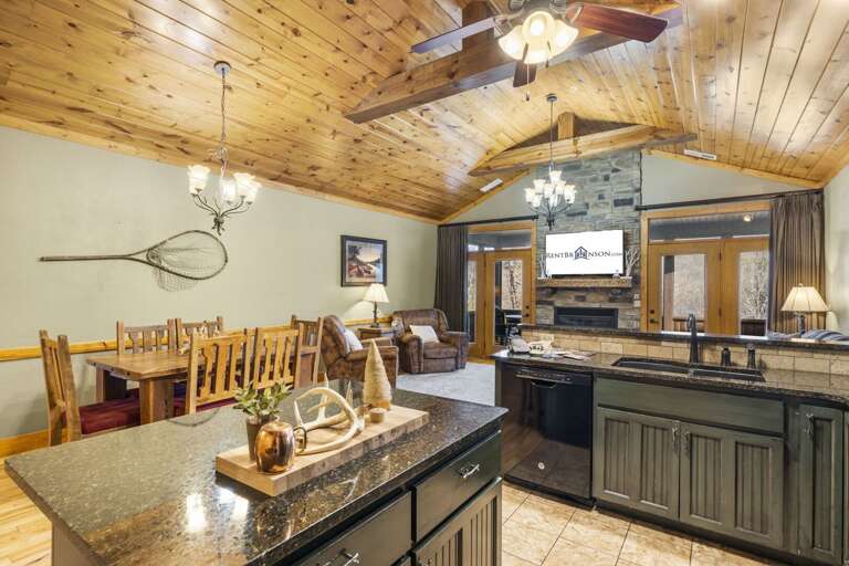 Rustic Vacation Rental With Wooden Ceilings, Kitchen Island, And Dining Area Rustic Vacation Rental With Wooden Ceilings, Kitchen Island, And Dining Area