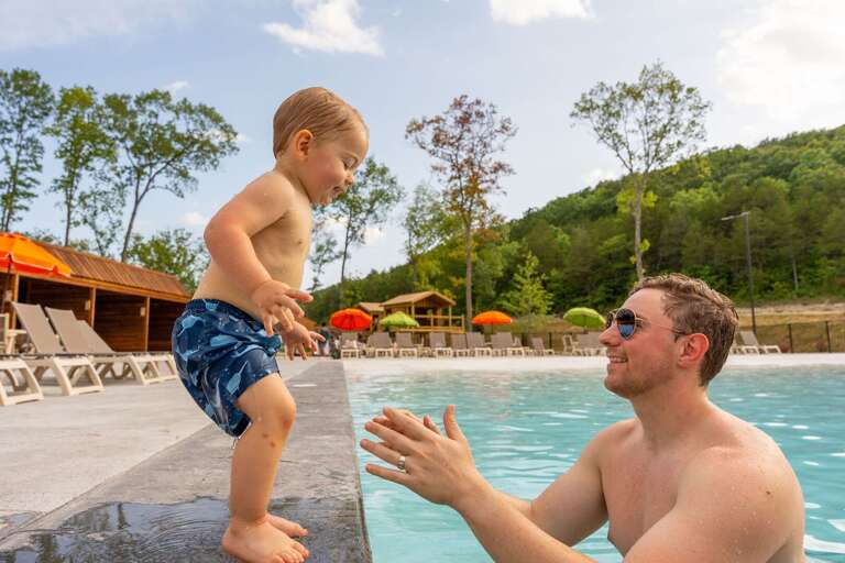 Father And Toddler Playing At Poolside, Sunny Sky Backdrop