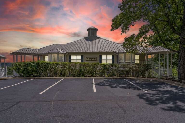 Building At Dusk With Vibrant Sky And Vacant Parking