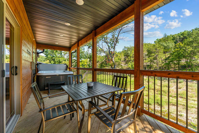 Wooden Deck With Dining Set And Hot Tub, Overlooking Lush Greenery