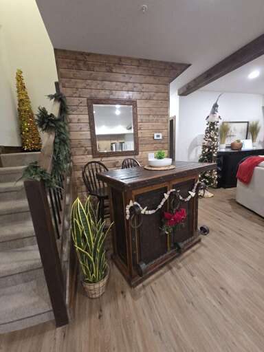 Wooden Walls With Winding Stairs, Dining Area Decked In Festive Flair
