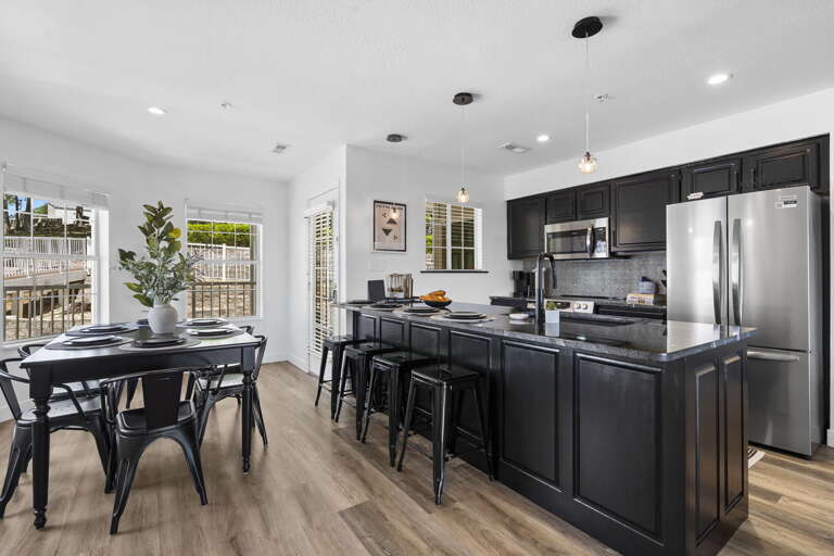 Sleek Kitchen And Dining Space In Spacious Vacation Rental