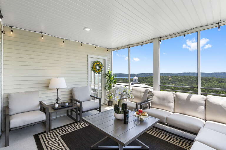 Porch Perched Over Panoramic Landscape, Plush Seating, Serene Setting