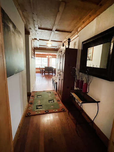 hallway from kitchen to living area and bedrooms