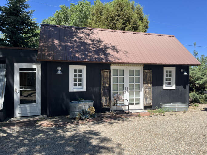 Studio with separate sleeping space across driveway from main house