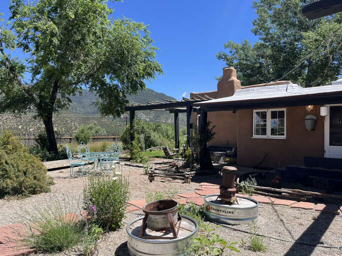 Front Entry area with summer plantings, cafe table