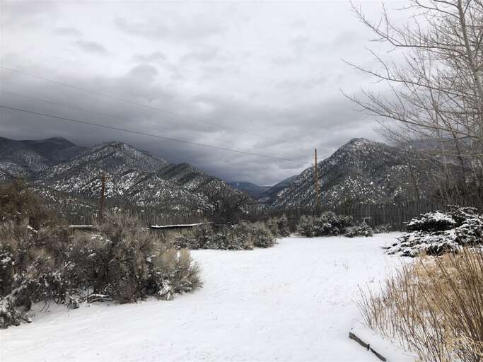 Snow Covered Driveway and Mountains in Winter