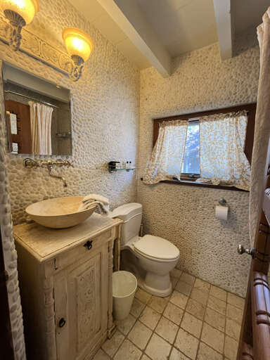 Primary suite white river rock bathroom