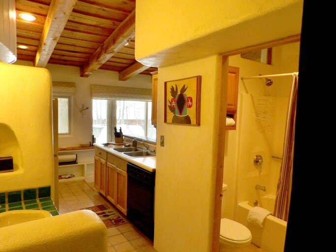 View of Bathroom, Vanity and Kitchen from Entry