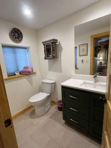 Refresh in your private bathroom with a modern vanity, soft towels, and thoughtful touches that make you feel right at home.