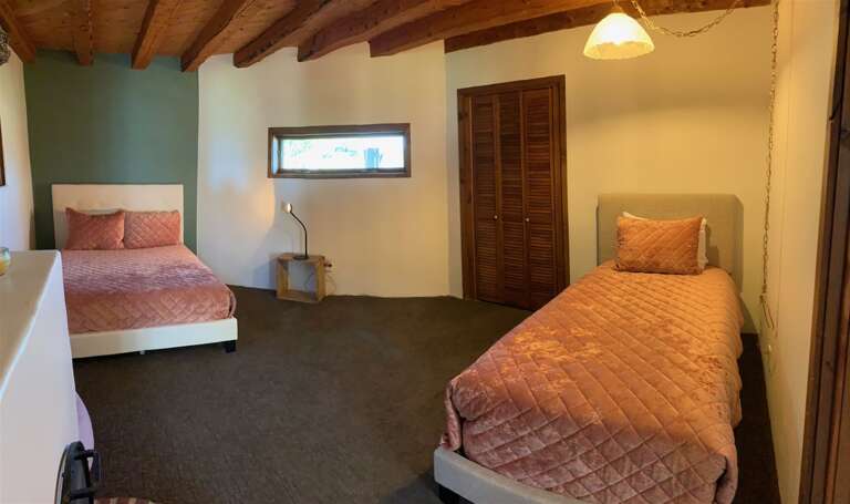 Bedroom with a full and twin bed