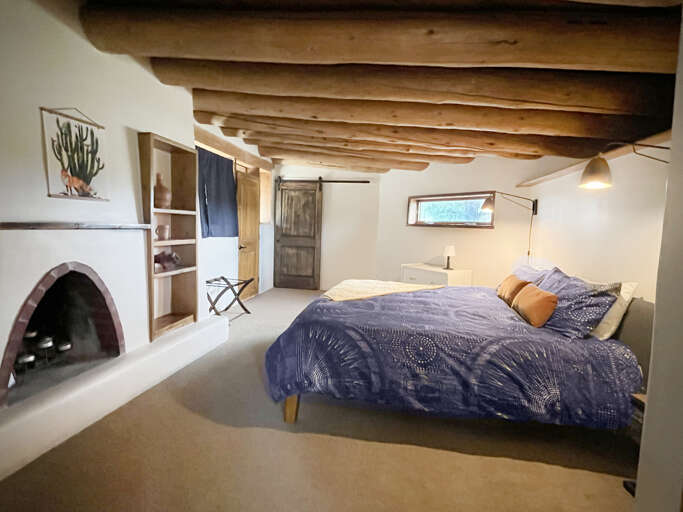 Upstairs king bedroom with luggage rack and large closet