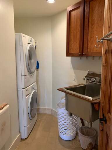 Laundry area off kitchen hallway
