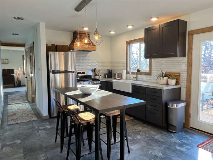 Kitchen, dining and hall to bedrooms