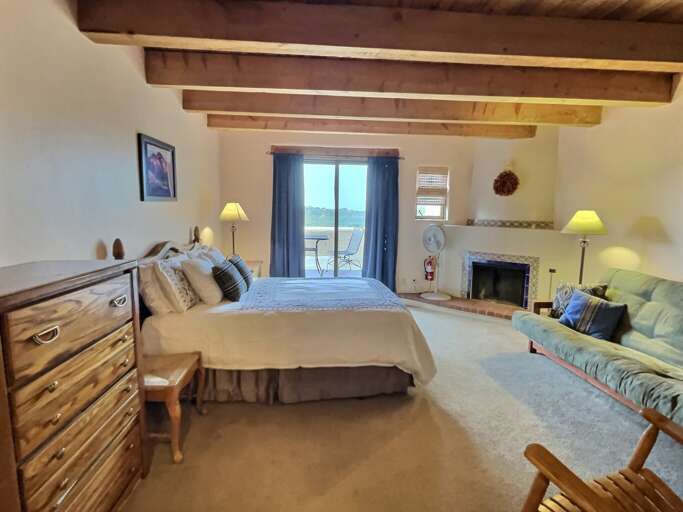Bedroom view to private deck overlooking the Rio Hondo valley with seating