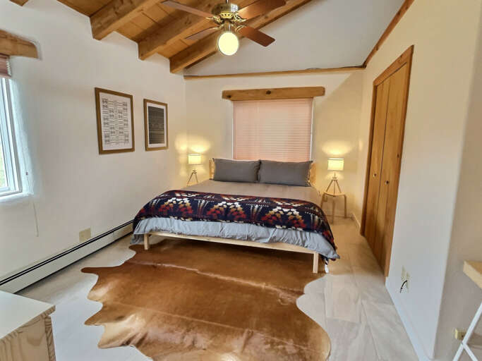 King bedroom with shades drawn