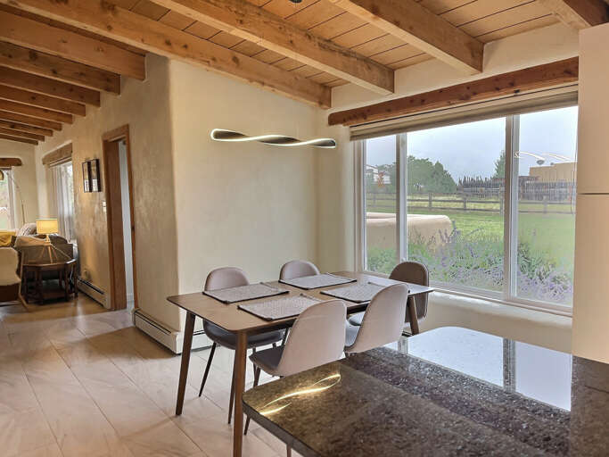 Kitchen table overlooking a large lawn