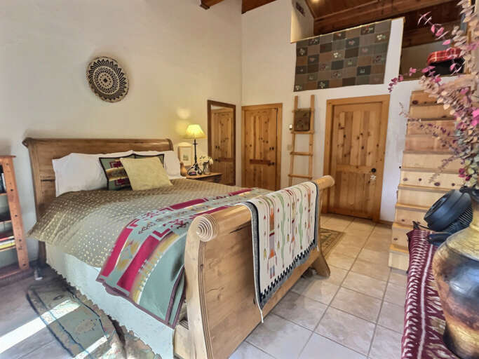 The charming queen bedroom with sleigh bed and lofty down duvet
