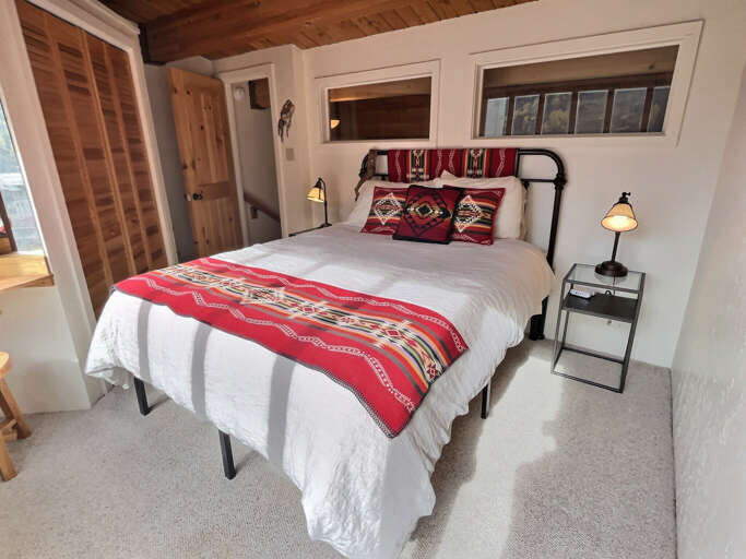Third level queen bedroom gives you a view and a special quiet at the top of the house