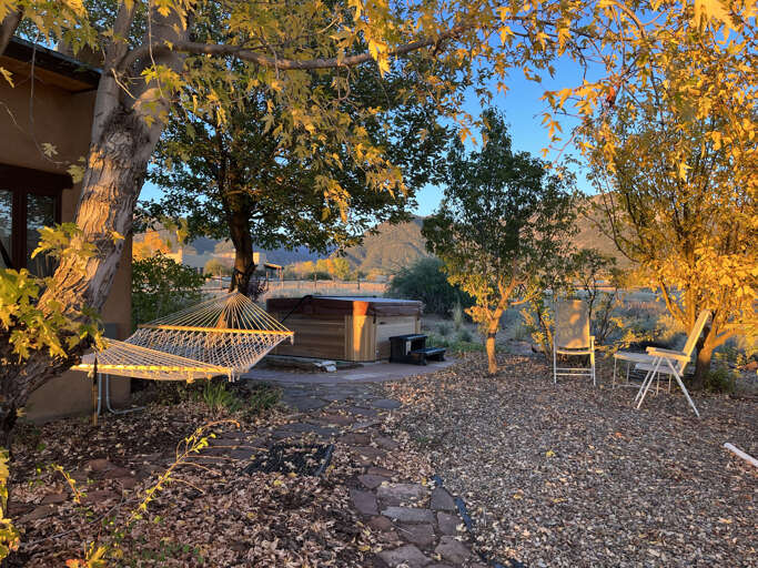 Hammock and hot tub in the autumn sun.
