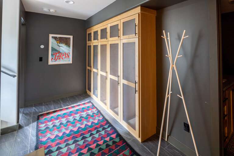 Garage entry boot locker area for gear drop before heading upstairs.