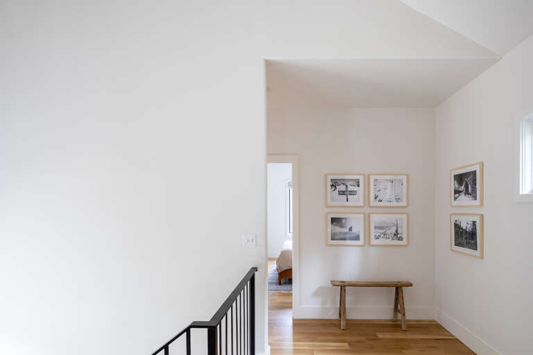 The upper landing above the kitchen, dining and living areas accesses three queen bedrooms