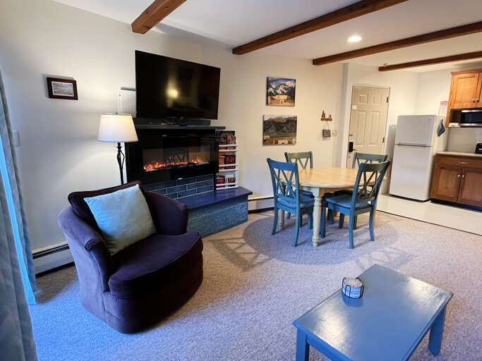 Living area with fireplace and smart TV