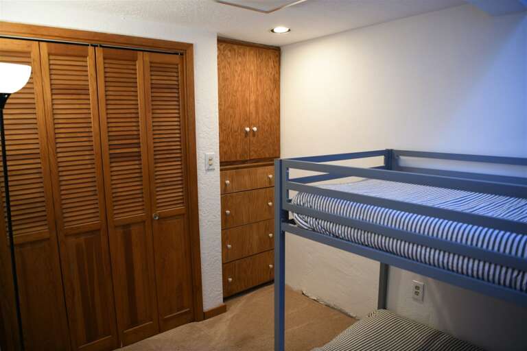 Bunk bed room with storage