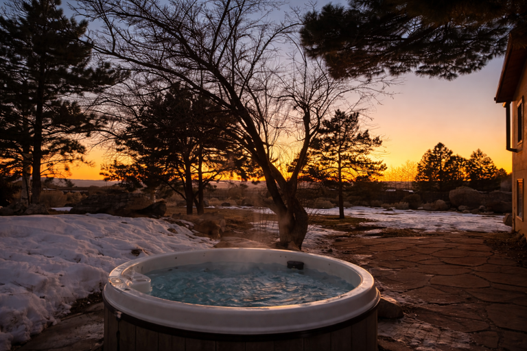 Soak in your private hot tub while watching the sunset