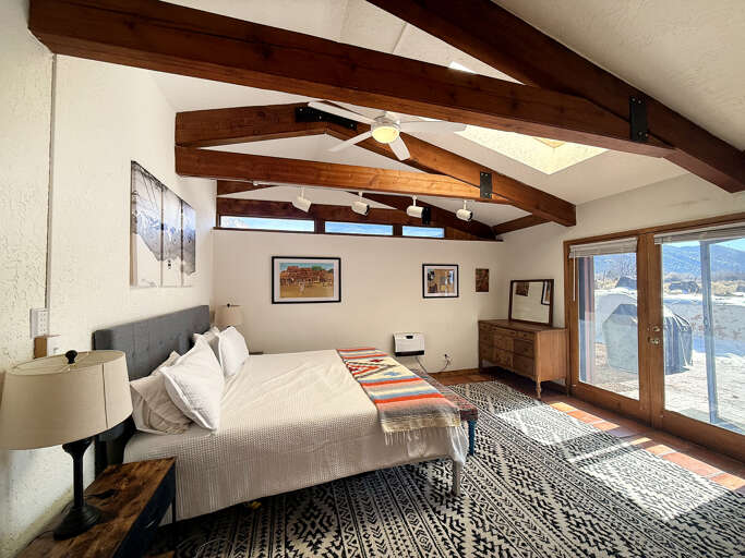 Spacious King bedroom with ensuite bath and hot tub/patio access