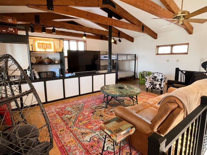 Upstairs living room is comfy, functional and great for groups